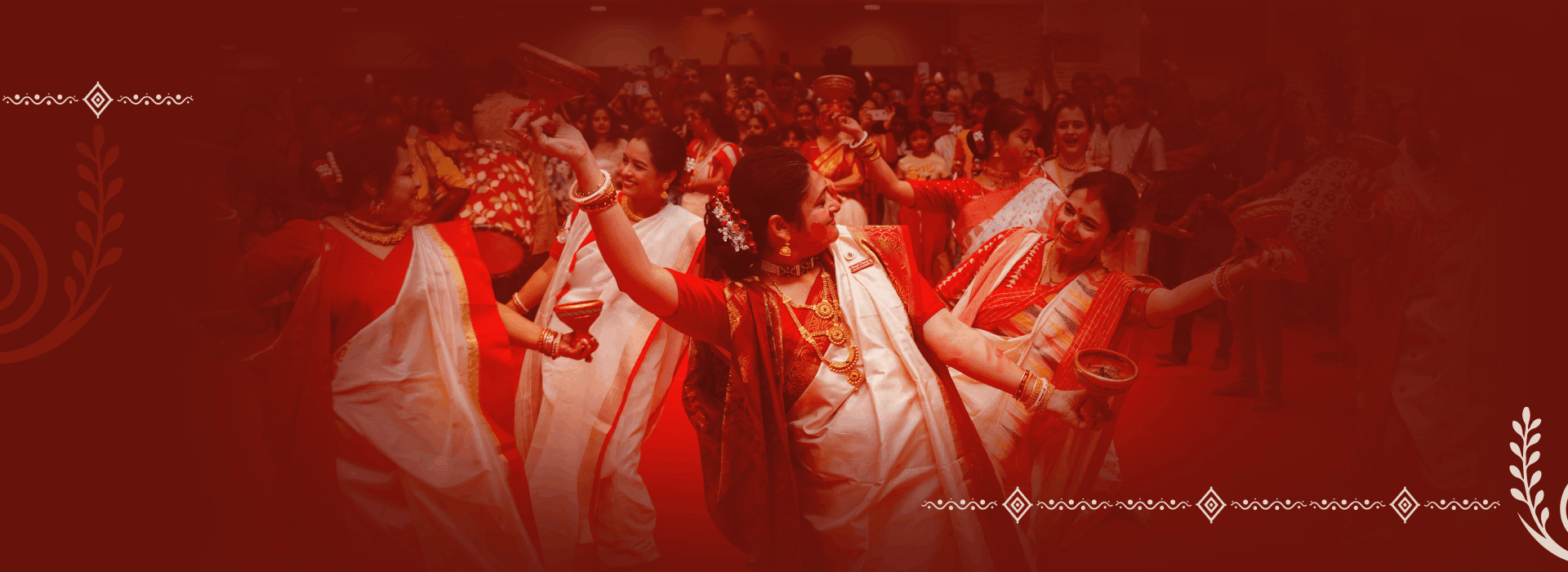 Women in traditional Bengali attire celebrating Dhunuchi Naach at HCAF's Durga Puja
